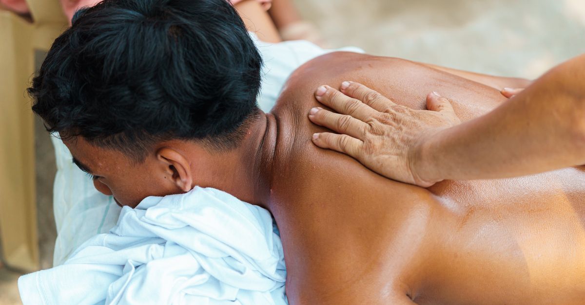 A soothing outdoor massage session targeting relaxation and wellness.