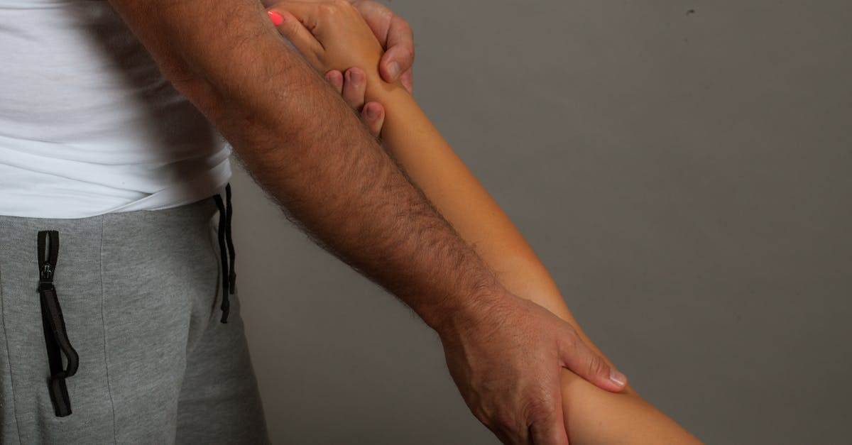 Close-up of therapist performing a soothing arm massage promoting relaxation and well-being.