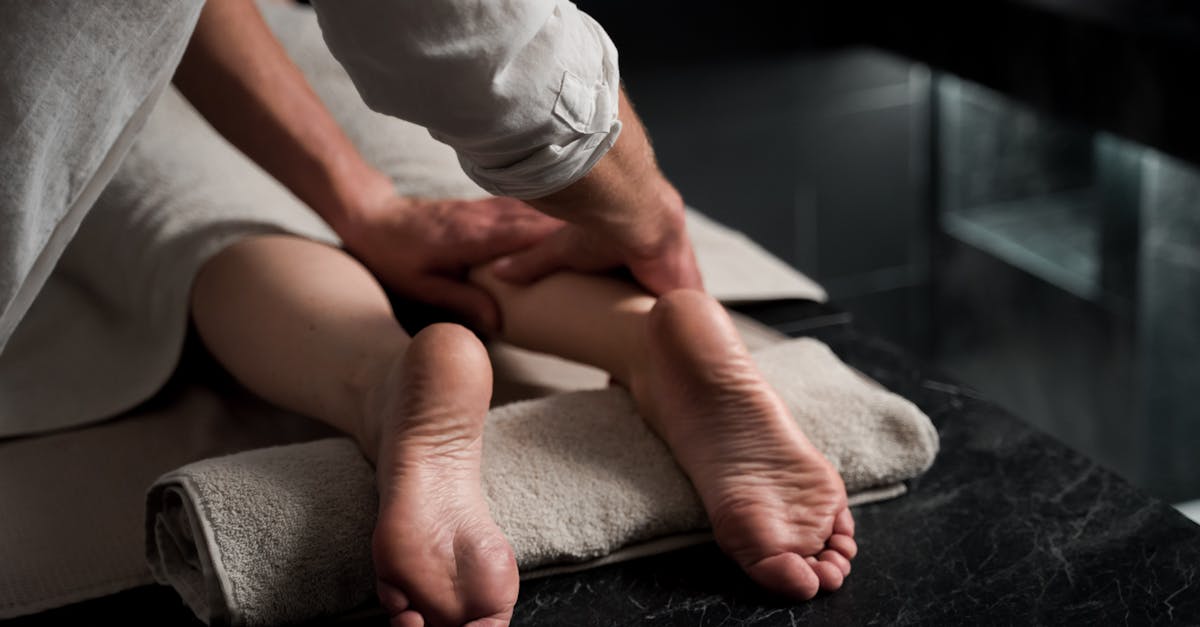 Close-up of a relaxing foot massage in a spa, emphasizing comfort and care.