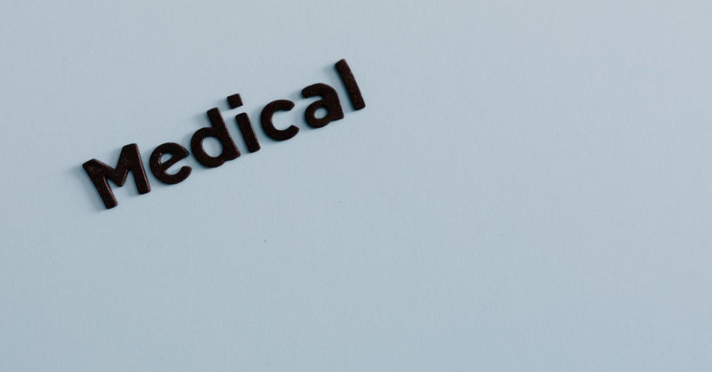 Simple typography of the word 'Medical' on a light background conveys healthcare concept.